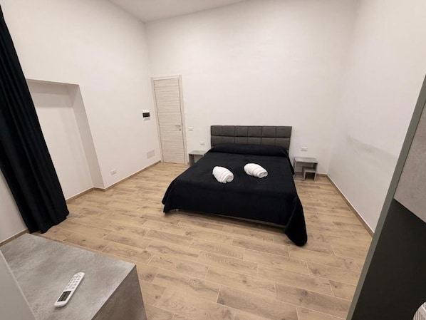 Premium Quadruple Room, Courtyard View | Desk, blackout curtains, soundproofing, iron/ironing board