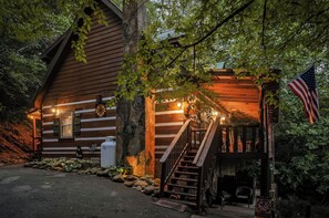 A wooden cabin with a porch, a staircase, and an American flag. - New Listing Hot Tub, Pool Table, Free Attractions (Sevierville)