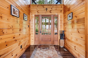 A wooden hallway with a double door, framed pictures on the walls, and a rug on the floor. - New Listing, Game Room, Hot Tub, Free Attractions, Mountain View (Sevierville)