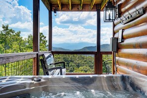 A hot tub on a balcony with a view of mountains and trees. - New Listing, Game Room, Hot Tub, Free Attractions, Mountain View (Sevierville)
