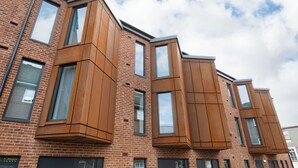 A multi-story building with large windows and a brick facade. - Student Only Waterloo House (York)
