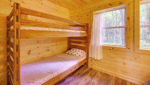 A wooden bunk bed room with a window and curtains. - Letchworth Cabin: Lake Access, Slide, Canoe Rental (Bliss)
