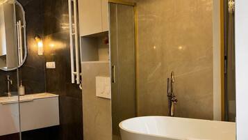 Shower, hair dryer, towels, shampoo