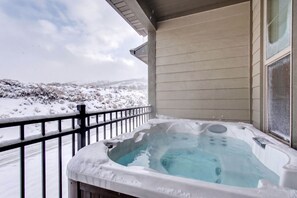 A hot tub on a balcony with a snowy landscape view. - Grill-Mnt Views-Private Hot Tub-King Bed-Sleeps 12 | Moose Mgmt 1132 (Park City)