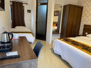 Family Room, Balcony, Courtyard View | In-room safe, soundproofing, free WiFi - Welcome Inn (Grand Baie)