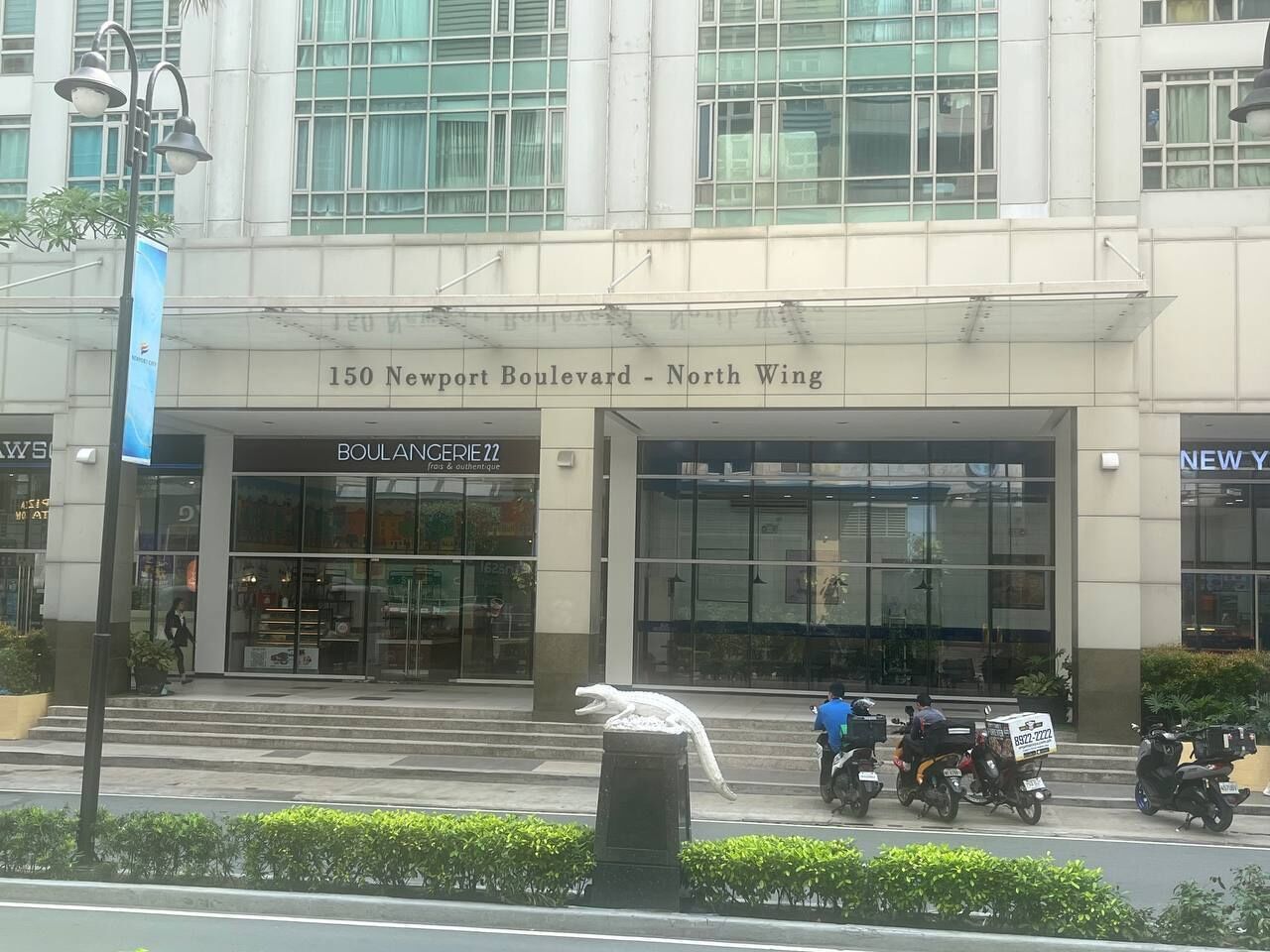 A building with a sign reading "150 Newport Boulevard - North Wing".