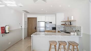 Economy Apartment, Sea View | Private kitchen | Fridge, microwave, oven