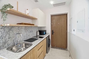 Apartment, Sea View | Private kitchen | Fridge, microwave, oven - El Alamein Towers  (el alamein)