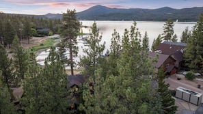 A lakeside property with a dock, cabins, and a mountain backdrop. - NEW Lakefront (Location, about the cabin, game room, and more!) (Big Bear Lake)
