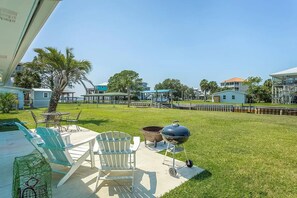Outdoor dining - Walk to Mashes Sands Beach, boat from your private dock, and bask in Old Florida in this one-story canal-front home (Panacea)