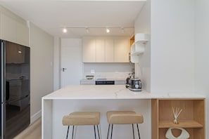 Fridge, microwave, oven, stovetop - Light and Modern | Designer Sea Point Gem (Cape Town)