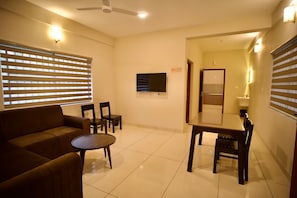 1 Bedroom Deluxe Apartment | Área de sala de estar