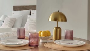 A dining table with plates, glasses, and a lamp. - Scala 16 | Parking | City Center (Gdańsk)