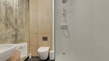 Shower, hair dryer, towels, shampoo