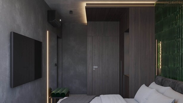 A modern bedroom with a large bed, a flat-screen TV, and a green wall. - Amberlight Boutique Hotel Nº13 | Adults Only|Sauna (Gdańsk)