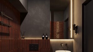 A modern bathroom with a toilet, sink, and mirror. - Amberlight Boutique Hotel Nº12 | Adults Only|Sauna (Gdańsk)
