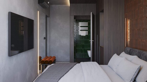 A modern bedroom with a large bed, a flat-screen TV, and a bathroom with a green-tiled wall. - Amberlight Boutique Hotel Nº12 | Adults Only|Sauna (Gdańsk)