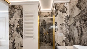 A modern bathroom with a shower, toilet, and vanity. - Granaria B209B | Jacuzzi | Best Location (Gdańsk)