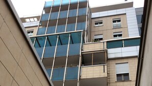 A multi-story building with a modern architectural design, featuring balconies and large windows. - Lorella's House (Terni)