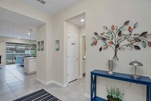 A modern interior with a kitchen area, a dining space, and a hallway leading to a private room. - Go!#24 - WINDSOR ISLAND (Davenport)