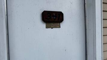 A door with a number plate indicating room 341 and a non-smoking sign.