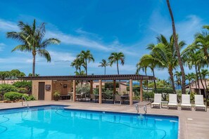 A pool area with lounge chairs, a pergola, and palm trees. - Wailea Ekahi 52D - Wailea 1BR Condo, Garden Lanai, AC, Island Luxury Beach Condo (Kihei)
