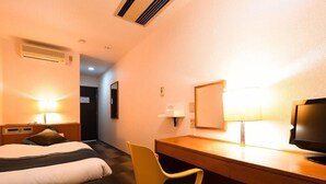 A hotel room with a bed, a desk, a chair, a television, and a lamp. - Hotel Area One Ise Inter (Ise)
