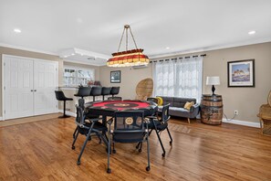 A dining area with a round table, chairs, and a chandelier. - Best of Grandview! 7 Beds, waterfront & dock! (Hampton)