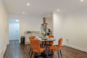 A modern kitchen with a dining area. - Host & Stay | Colquitt Street (Liverpool)