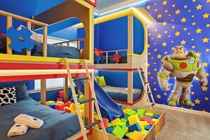 A children's playroom with bunk beds, a slide, and a large toy figure. - 9024 Solara brand new theme rooms pool near club (Kissimmee)