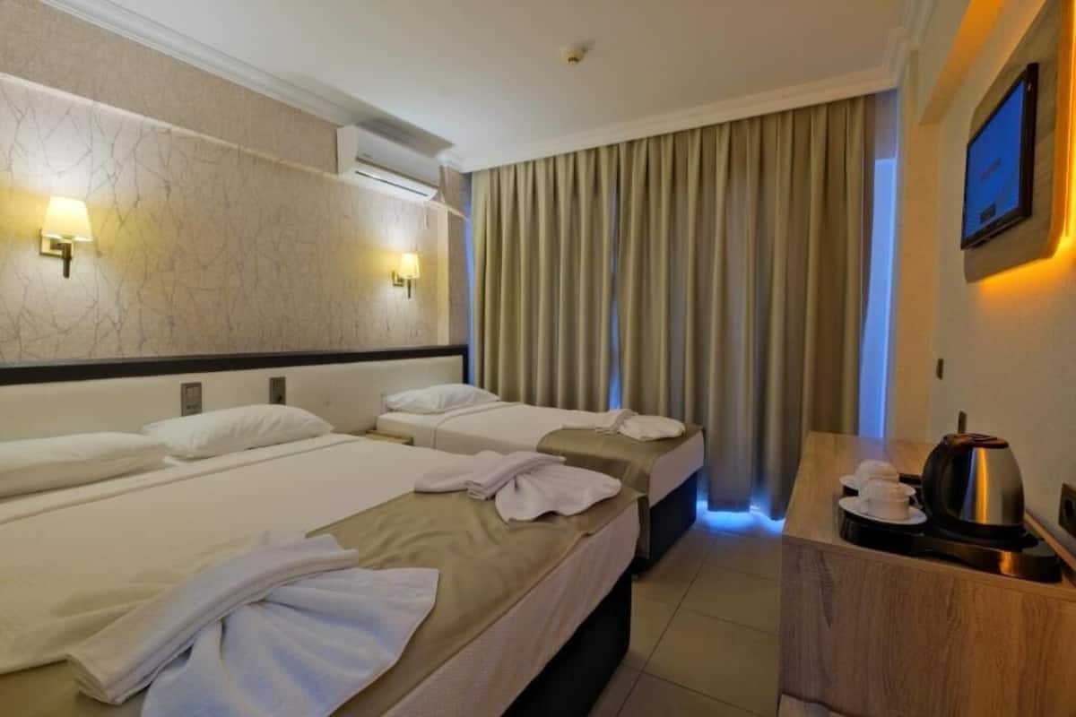 Family Triple Room, Balcony | In-room safe, soundproofing, iron/ironing board, WiFi (free)