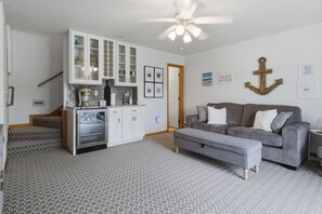 A modern kitchen with white cabinets, a built-in oven, and a ceiling fan. - Brush Creek Retreat With Boat Slip (Sunrise Beach)