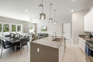 Cook, gather, and linger a little longer, because vacation meals are never just about the food. - Cozy Reunion Condo | 2 King Suites | Near Disney (Kissimmee)