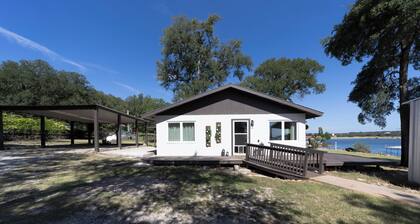 Serene Lakefront Cottage on Lake Travis with Boathouse and swings.
