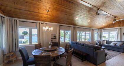 Serene Lakefront Cottage on Lake Travis with Boathouse and swings.