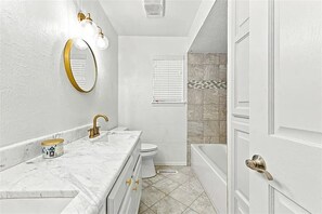 Shower, towels, soap, toilet paper