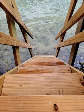 A wooden deck leading into clear water. - JV BEACHFRONT APARTMENT: YOUR DREAM OCEANVIEW SPOT (Añasco)