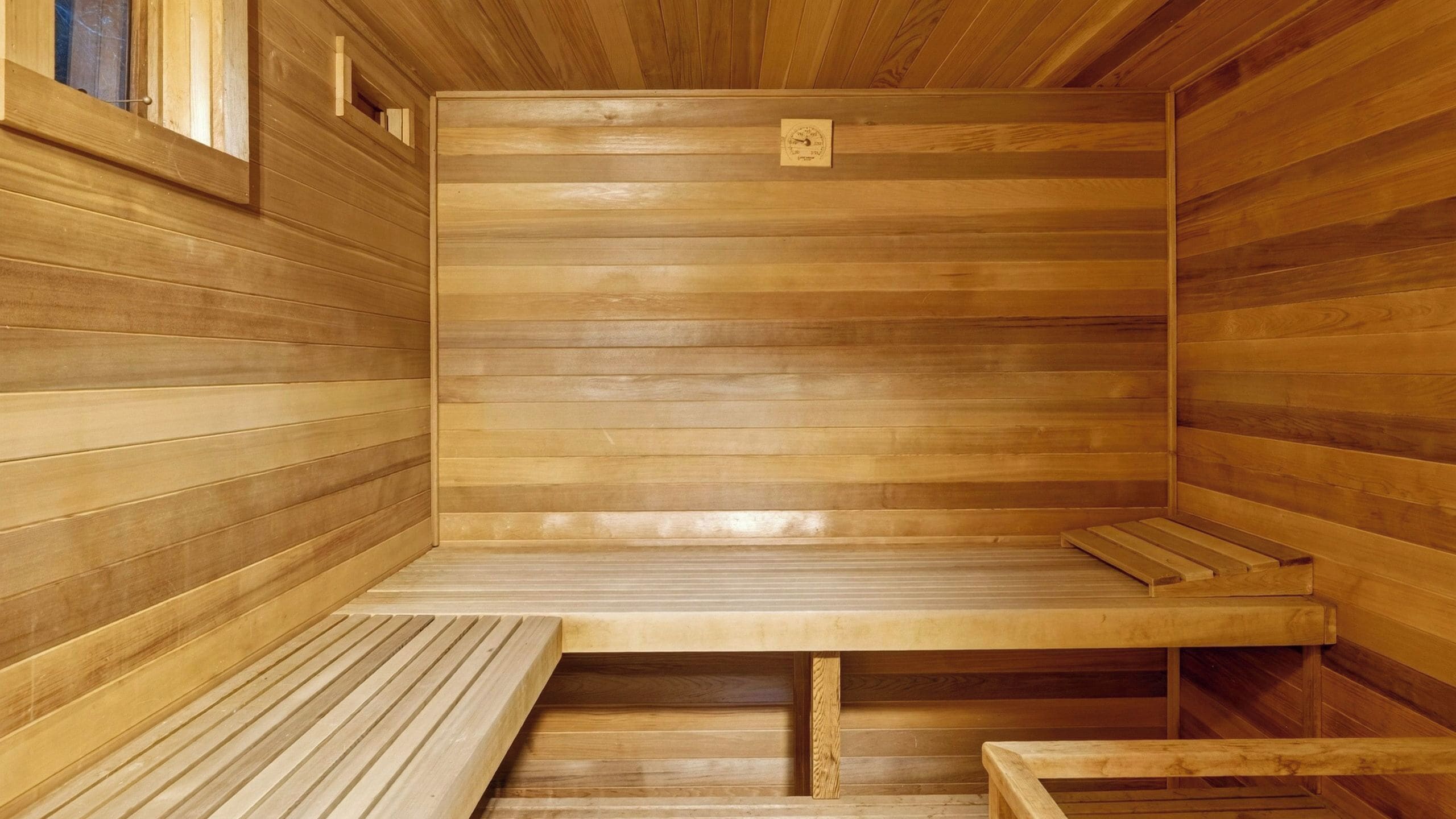 A sauna with wooden walls and benches.
