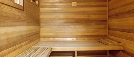 A sauna with wooden walls and benches.