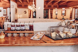 A breakfast bar with various food items and condiments.