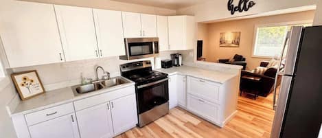 Coffee/tea maker, fridge, microwave, oven