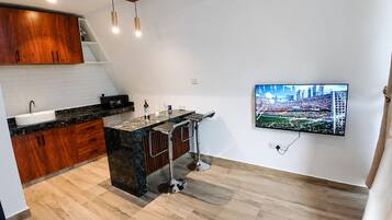 Deluxe Studio, Garden View | Desk, laptop workspace, free WiFi