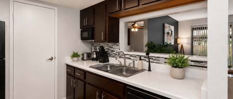 Coffee/tea maker, fridge, microwave, oven