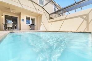 An outdoor swimming pool with a patio area, a grill, and a covered seating area. - Private Pool •Free Parking •Cozy Solara Resort Home Near Disney •Sleeps 12 Guest (Kissimmee)
