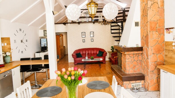 A modern interior with a dining area, kitchen, and living space. - Mrzezyno Holiday Home for 5 People (Trzebiatow)