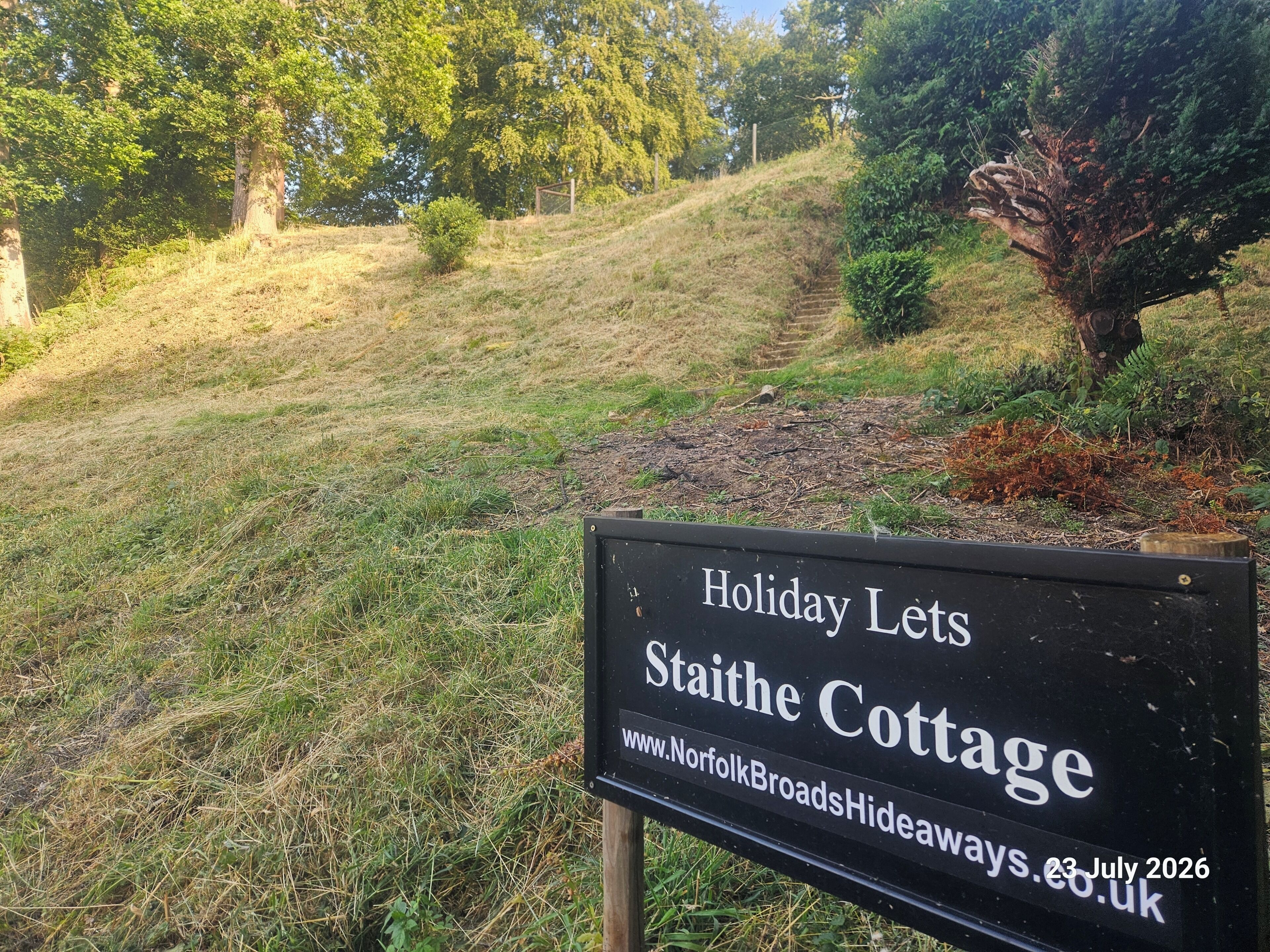 A sign for Staithe Cottage advertising a holiday let.