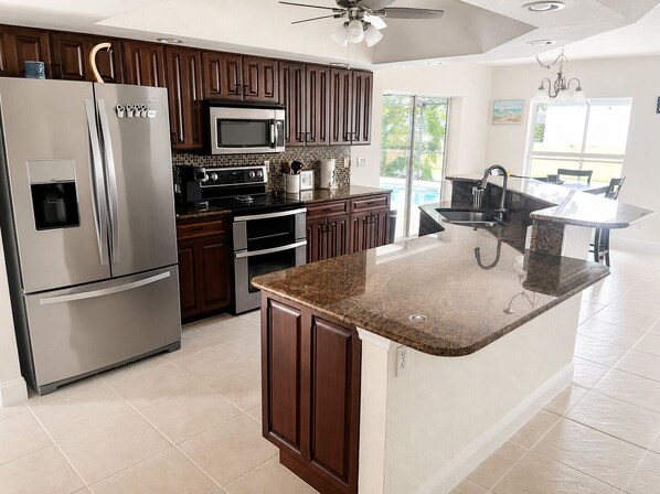 Coffee/tea maker, fridge, microwave, oven