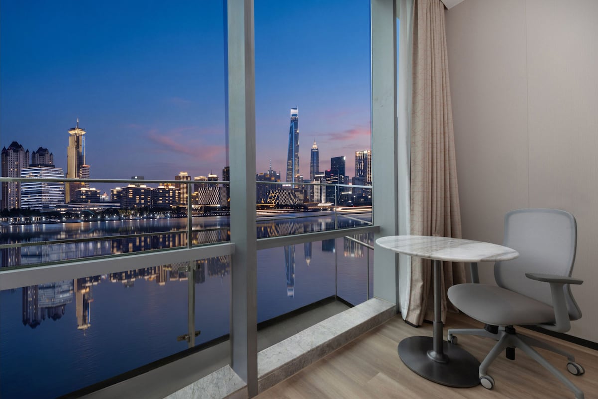1 Bedroom Suite River View Balcony | Down comforters, desk, laptop workspace, blackout drapes