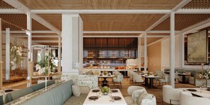Un amplio vestíbulo de hotel con una zona de estar central, una cocina grande visible a través del vidrio, y un diseño de techo moderno.