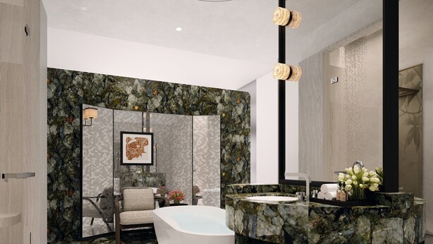 Un baño moderno con una bañera independiente, un tocador de mármol y un espejo grande.
